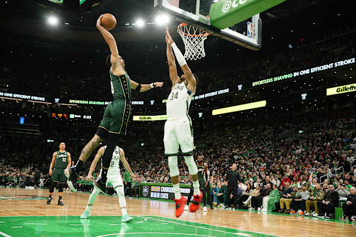 Milwaukee Bucks forward Giannis Antetokounmpo defends Boston Celtics forward Jayson Tatum